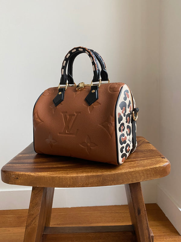 Louis Vuitton Limited Edition Creme Wild at Heart Monogram Canvas Speedy  Bandouliere 25 Bag - Yoogi's Closet