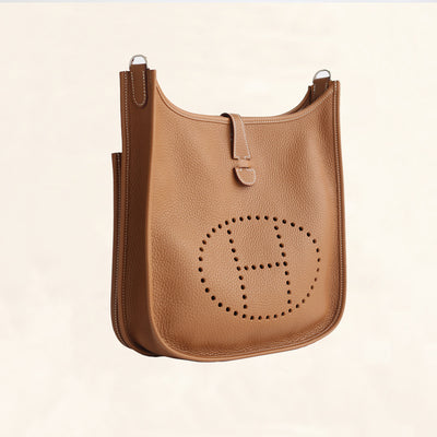 HERMÈS  GOLD EVELYNE III PM BAG IN CLEMENCE LEATHER WITH