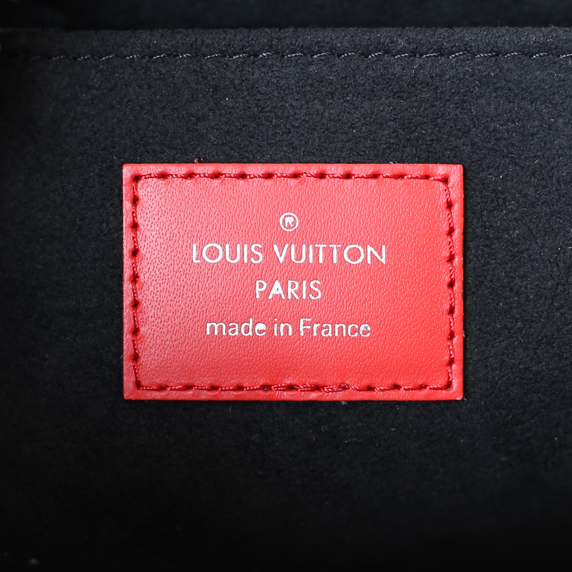 red supreme bag louis vuittons
