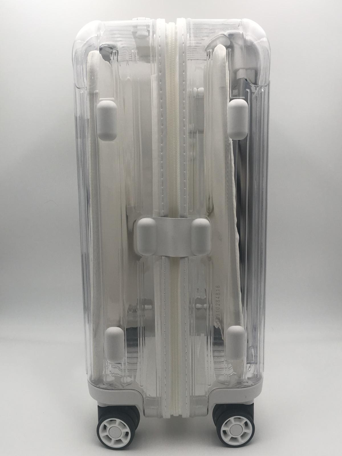Clear suitcase top off white